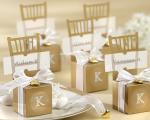 miniature gold chair favor box with heart charm and ribbon